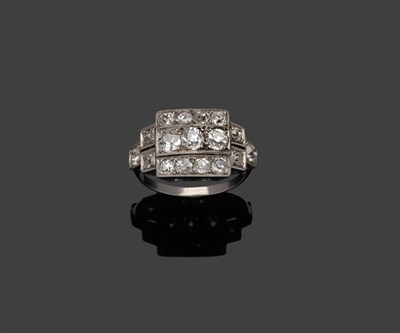 Lot 302 - An Art Deco Style Diamond Ring, old cut diamonds arranged in a geometric design, in white...