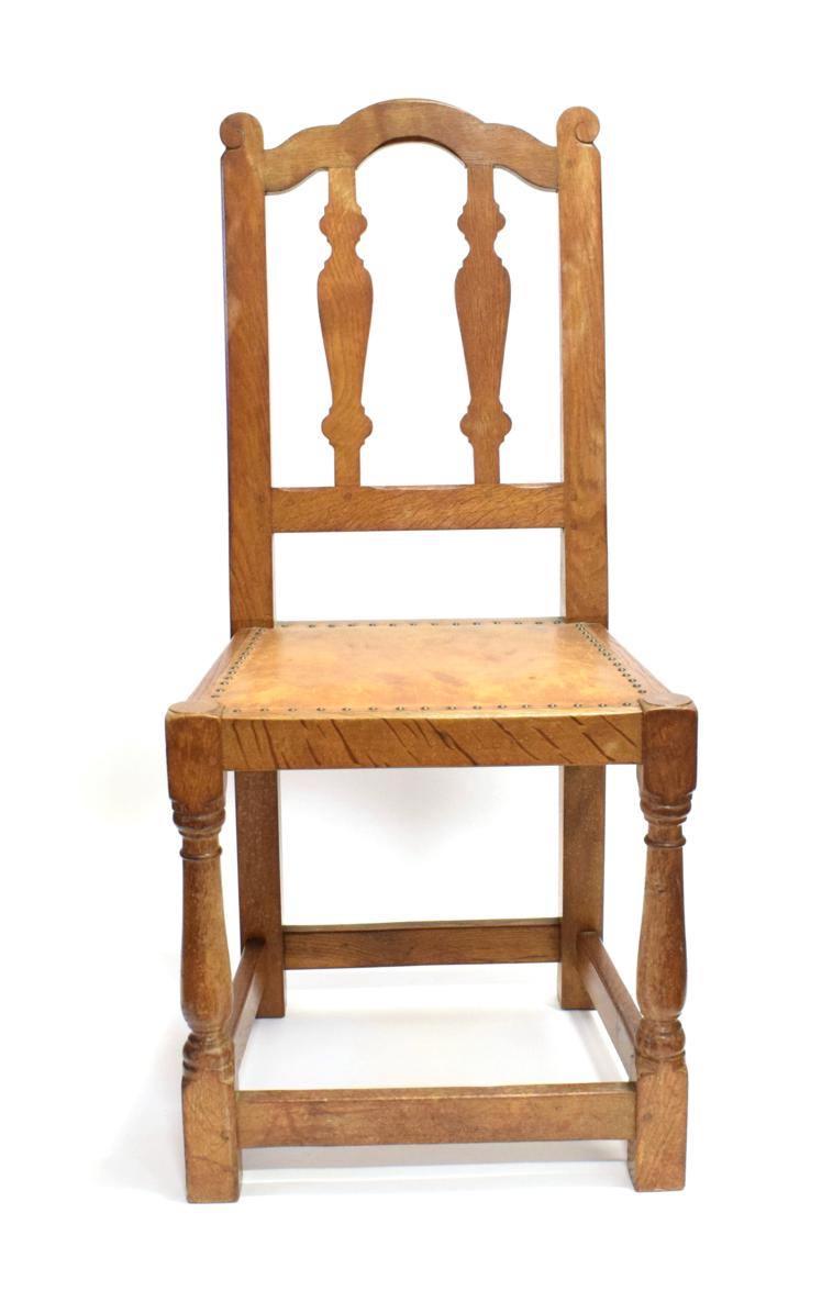 Lot 3584 - Mouseman: A 1920's Robert Thompson of Kilburn English Oak Chair, with shaped top rail, vase splats
