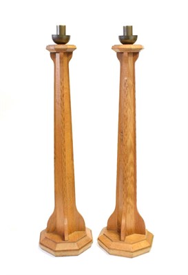 Lot 3646 - A Pair of Arts and Crafts English Oak Candlesticks, designed by Peter Johnson, made by Thompson...