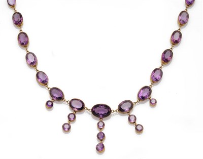 Lot 312 - A Victorian Amethyst Necklace, a collar of oval cut amethysts with graduated drops pendant,...