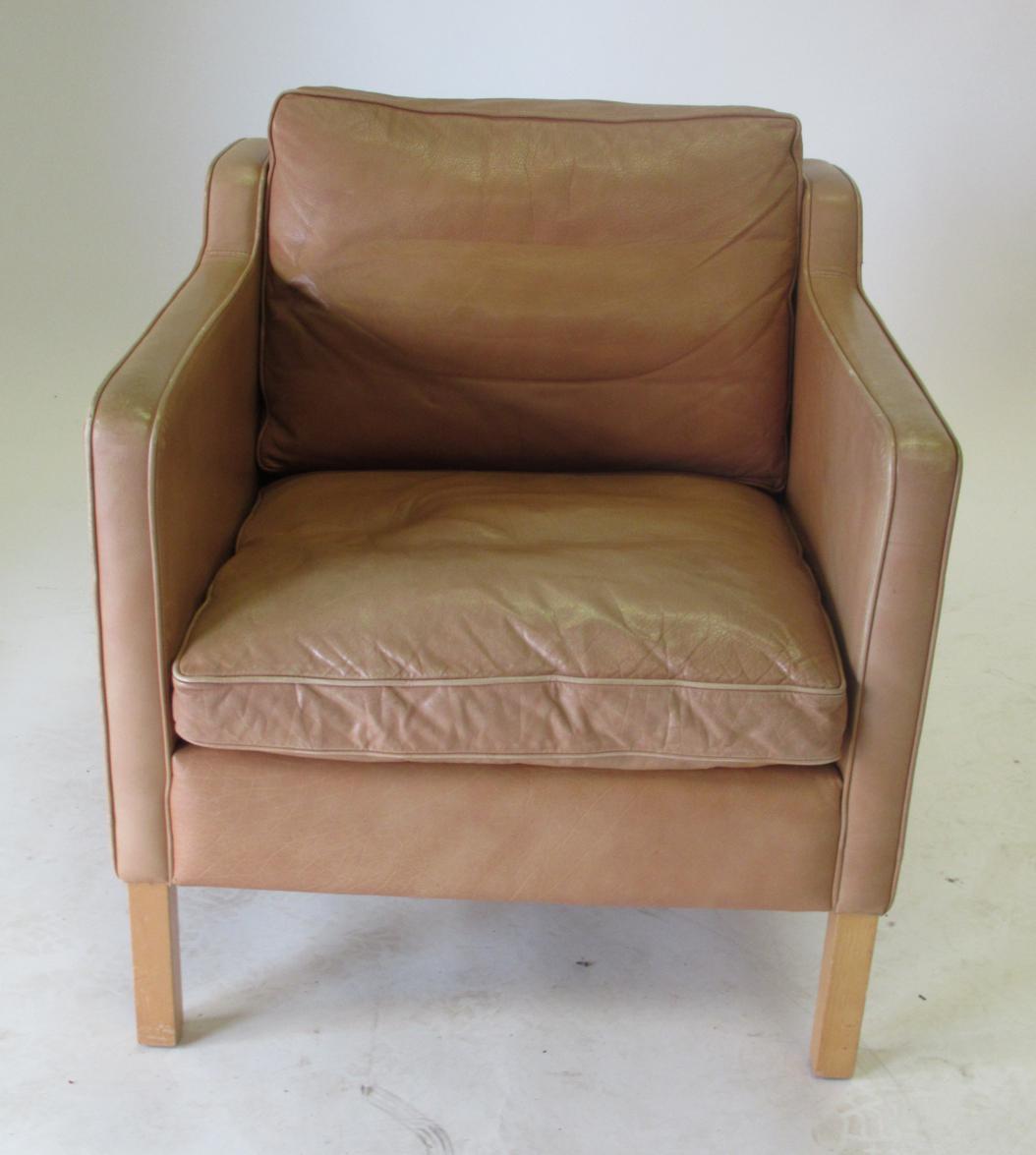 Lot 3657 - Stouby: A Danish Design Lounge Chair, in the manner of Borge Mogensen, covered in tan leather, with