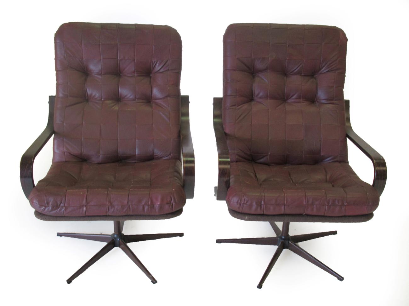 Lot 3658 - A Pair of 1970's Danish Design Swivel Armchairs, with leather cushions, bentwood arms and aluminium