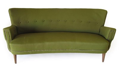 Lot 3666 - A Danish Design 1950's Sofa, of curved form, upholstered in green wool with button back, on...