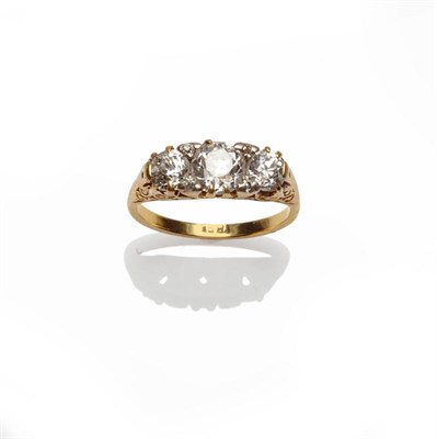 Lot 315 - A Victorian Diamond Three Stone Ring, the graduated old cut diamonds set with small rose cut...