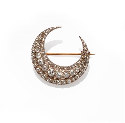 Lot 316 - A Victorian Diamond Crescent Brooch, three rows of old cut and rose cut diamonds in claw...