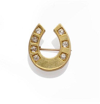 Lot 317 - A Diamond Set Horseshoe Brooch, seven old cut diamonds set into a plain polished yellow gold mount