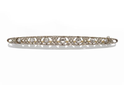 Lot 321 - A Diamond Brooch, circa 1920-30, graduated brilliant cut diamonds spaced by cross shapes set...