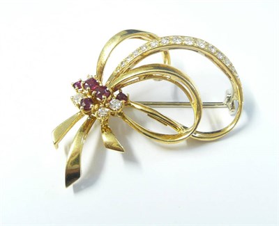 Lot 323 - An 18 Carat Gold Ruby and Diamond Ribbon Brooch, a cluster of round brilliant cut rubies and...