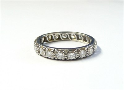 Lot 324 - A Diamond Eternity Ring, the nineteen round brilliant cut diamonds in white claw settings,...