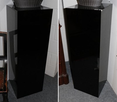Lot 1003 - A Pair of Black Lacquer and Laminated Pillars, modern, of square form, 40cm by 40cm by 120cm...