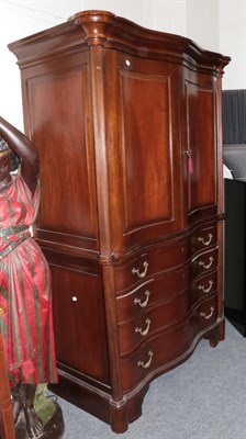 Lot 1005 - And So To Bed: An Eclectic Armoire, modern, of serpentine shaped form with two cupboard doors...