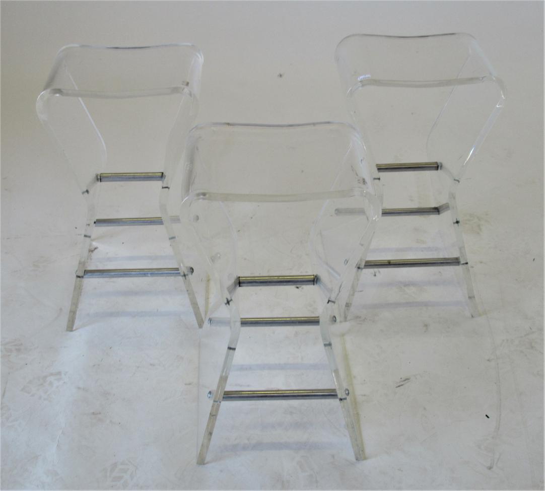 Lot 1010 - A Set of Three Late 20th Century Clear Plastic Side Tables, the splayed legs joined by tubular...