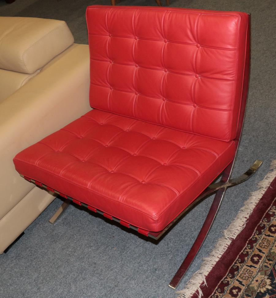 Lot 1014 - ^ A Barcelona Style Lounge Chair, modern, covered in red buttoned leather, 75cm by 76cm by 76cm