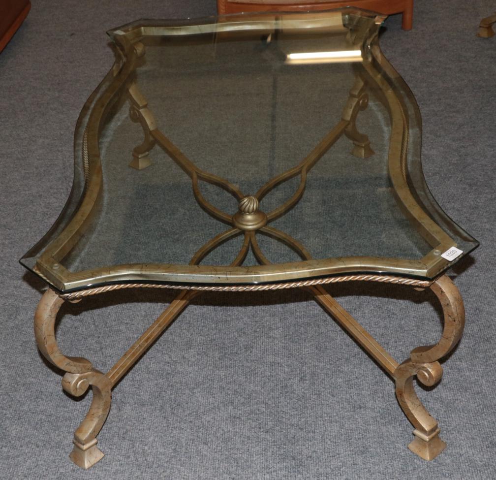 Lot 1020 - A Glass Top and Gilded Metal Rectangular Coffee Table, modern, of serpentine shaped form with a...