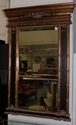 Lot 1026 - A Gilt Bevel Glass Mirror, the rectangular frame surrounded by reeded pilasters, the base with...