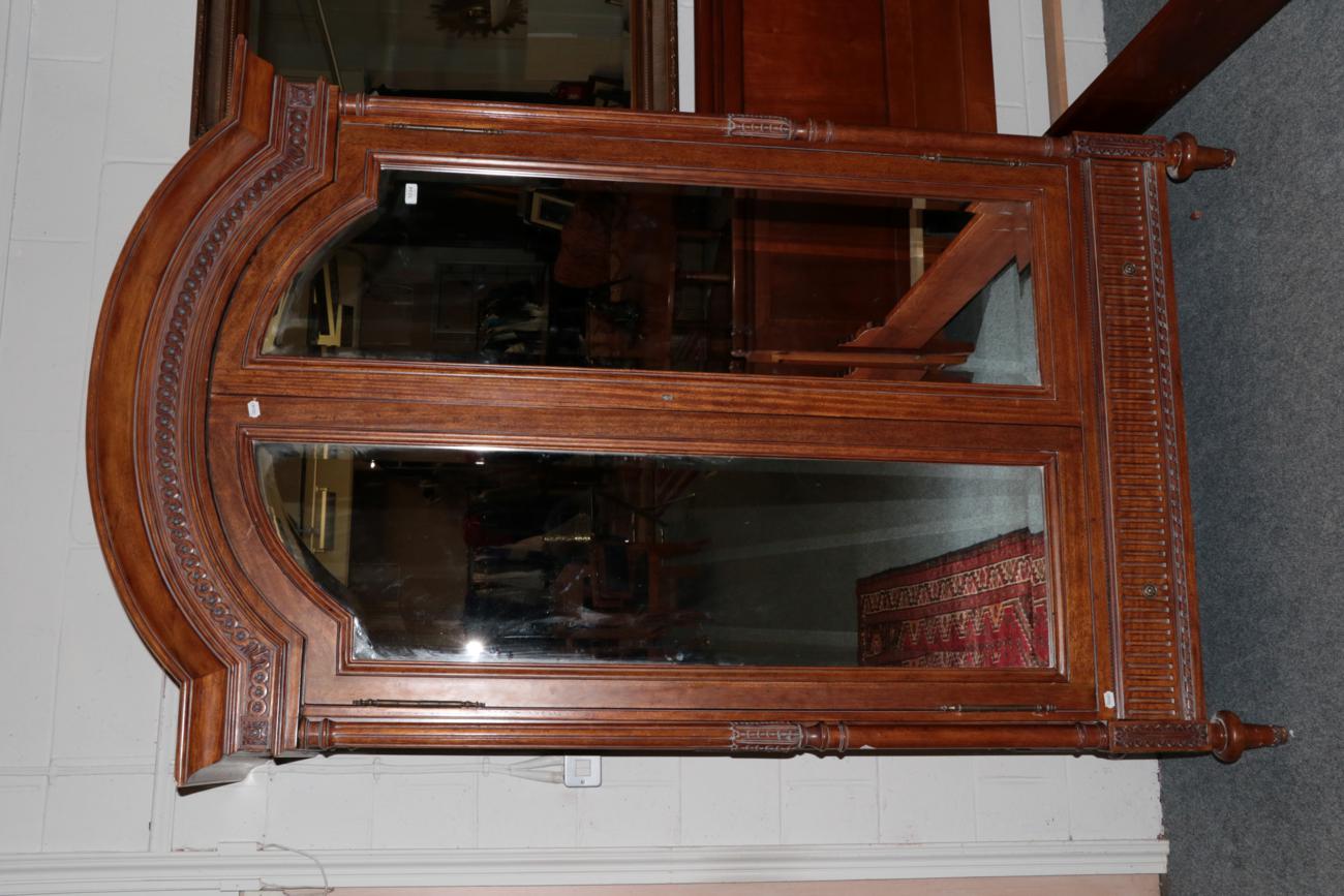 Lot 1034 - And So To Bed: A Walnut Effect Eclectic Wardrobe with Mirror, the moulded pediment above two...