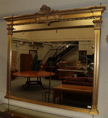 Lot 1043 - A Gilt Overmantel Mirror, in the Victorian style, the plain mirror plate surmounted by a...