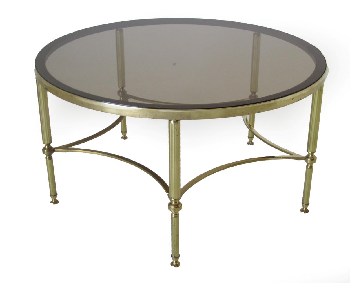 Lot 1048 - A Late 20th Century Brass and Glass Top Circular Coffee Table, the tinted glass on reeded legs...