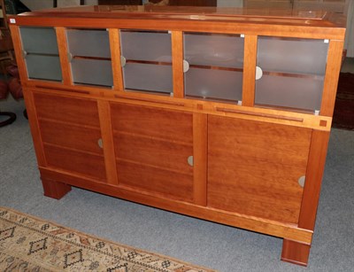 Lot 1056 - Leon Krier for Giorgetti: A Cherrywood Sideboard, with frosted glass doors and three cupboard doors