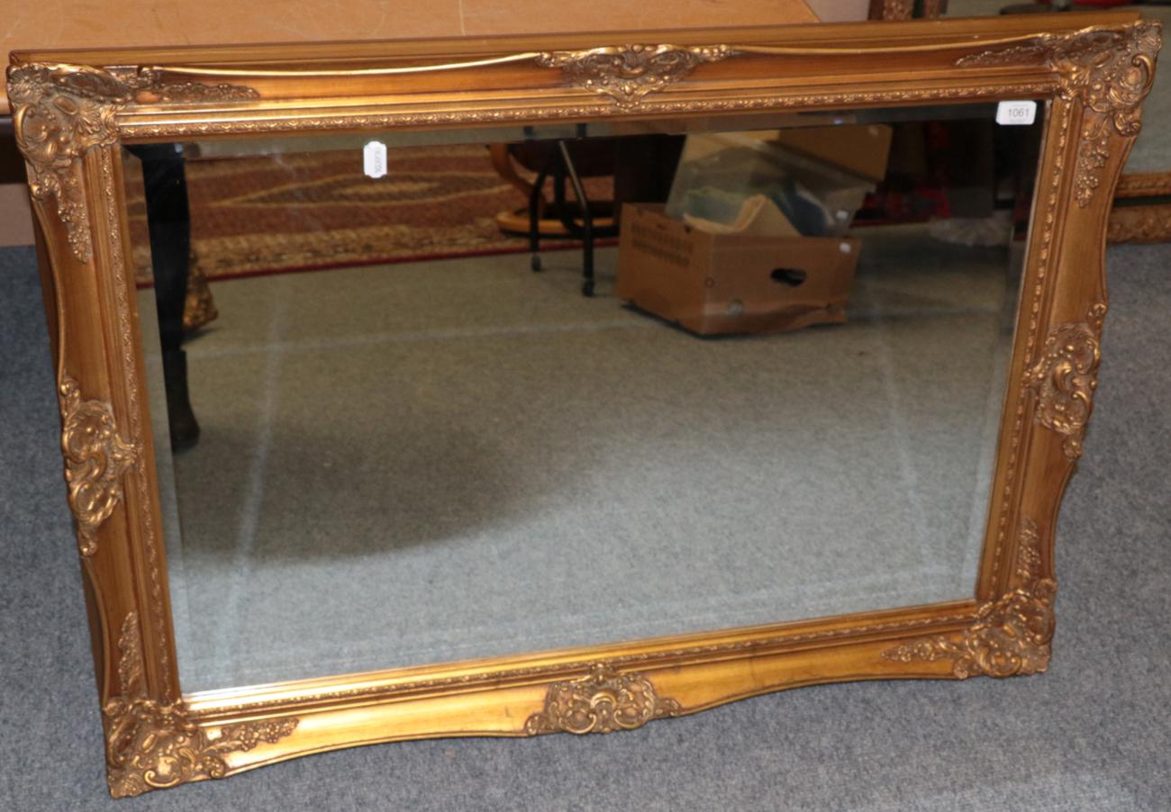 Lot 1061 - A Reproduction Gilt Bevelled Glass Mirror, 76cm by 106cm