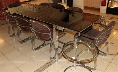 Lot 1063 - A 1970's Chromed and Glass Top Dining Table and Eight Chairs, including two carvers, the table...