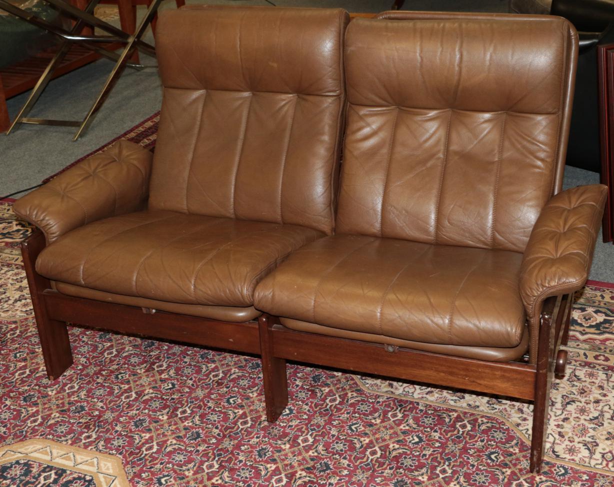 Lot 1065 - An Ekornes Brown Leather and Stained Beech Reclining Two-Seater Sofa, 147cm by 72cm by 89cm