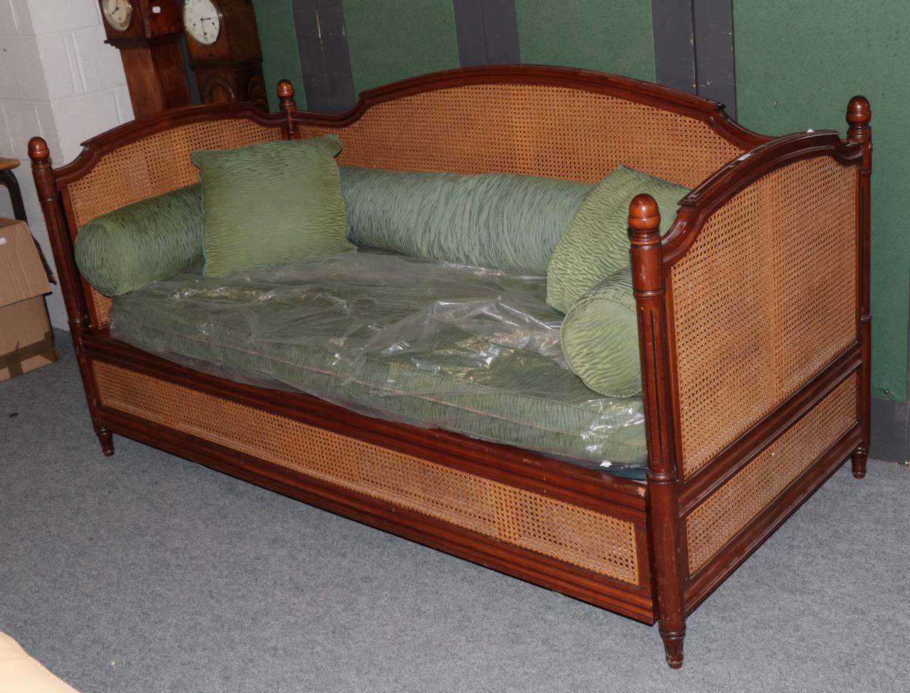 Lot 1070 - Simon Horn Furniture Ltd: Martinque, A Louis XVI Style Pull-Out Day Bed, with walnut effect...