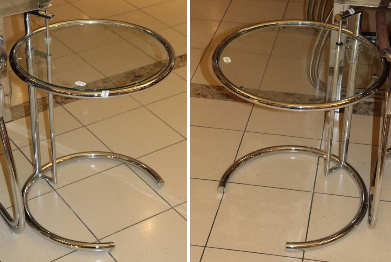 Lot 1073 - A Pair of Chromed Tubular Glass Top Circular Lamp Tables, modern, with adjustable height...