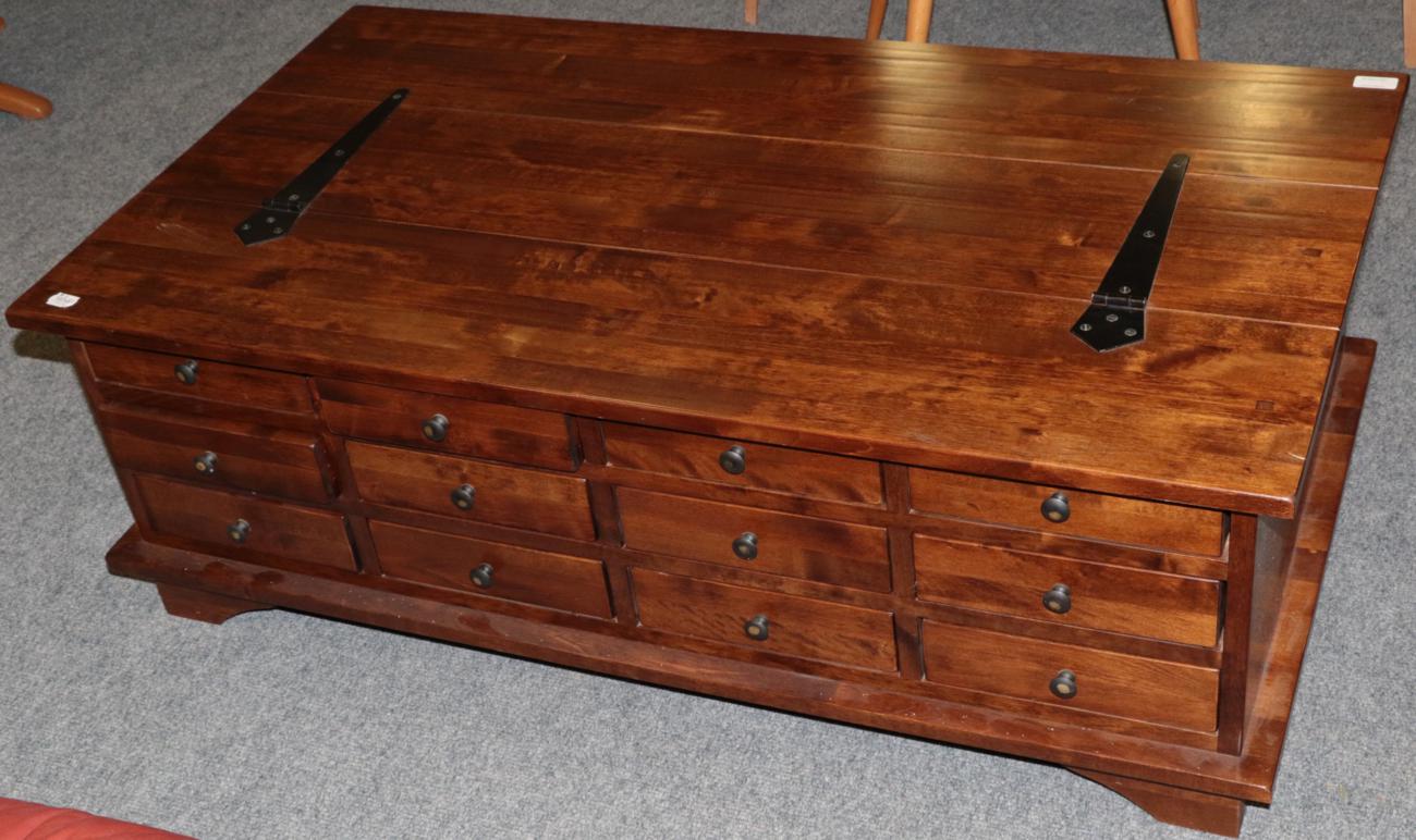 Lot 1074 - A Laura Ashley Garrat Cherry Twelve-Drawer Coffee Table, modern, of rectangular form with...