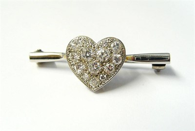 Lot 357 - A Diamond Heart Brooch, pavé set with round brilliant cut diamonds to a short plain polished white