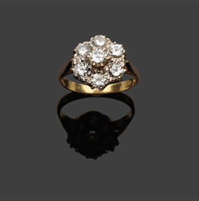 Lot 360 - An 18 Carat Gold Diamond Cluster Ring, seven round brilliant cut diamonds in white claw settings to