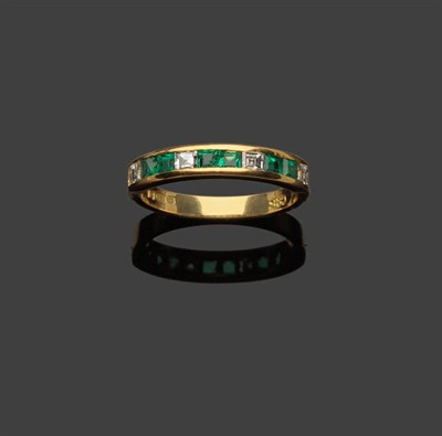 Lot 364 - An 18 Carat Gold Emerald and Diamond Half Eternity Ring, square cut diamonds alternate with...