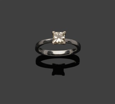 Lot 366 - A Platinum Princess Cut Diamond Solitaire Ring, the diamond held in a four claw setting, to a...