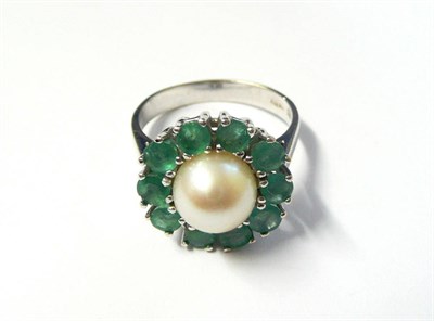 Lot 368 - A Cultured Pearl and Emerald Cluster Ring, the cultured pearl centres ten mixed cut emeralds,...