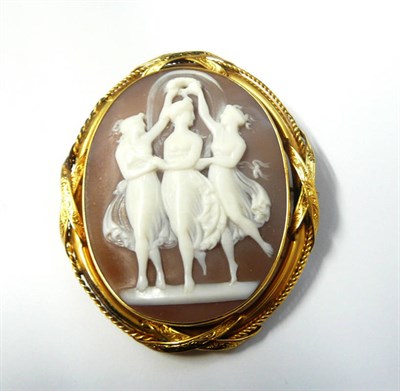 Lot 369 - A Cameo Brooch, the oval shell cameo depicting the three graces within an engraved and ropework...