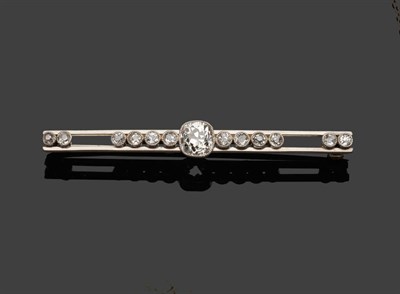 Lot 370 - An Early 20th Century Diamond Bar Brooch, an old cushion cut diamond flanked by six old cut...