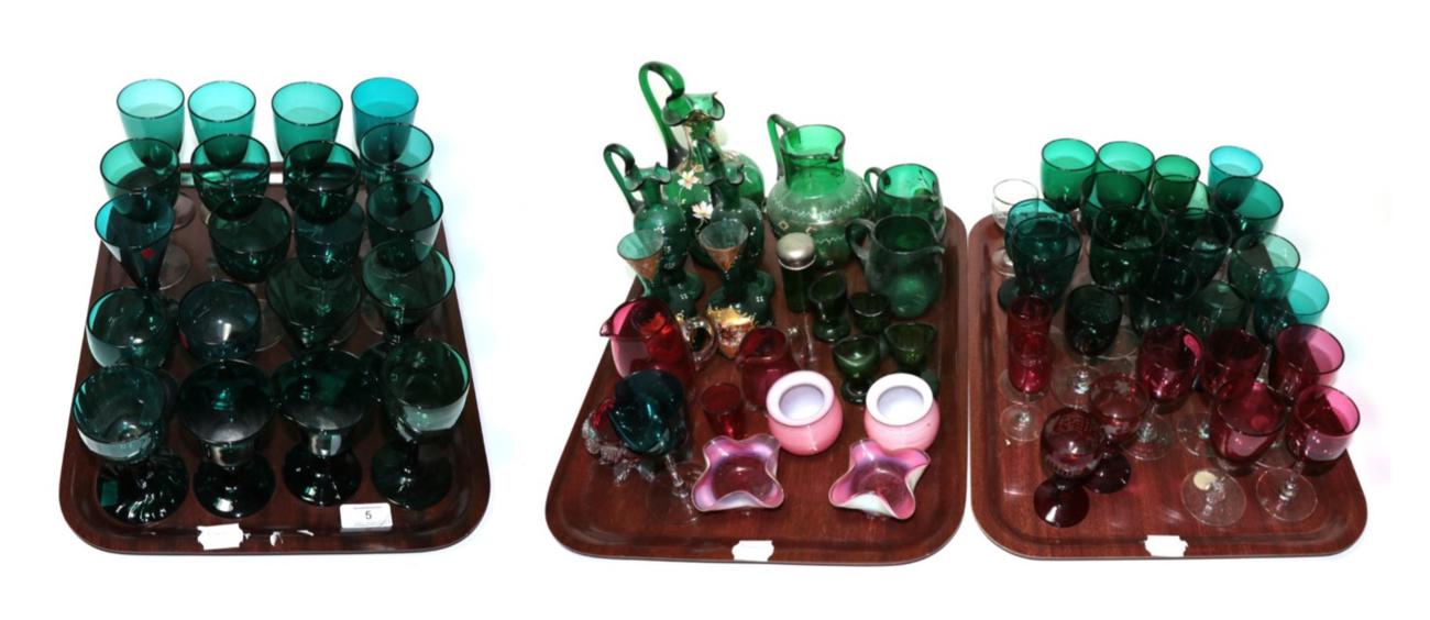 Lot 5 - ^ A collection of Victorian green and cranberry glass including: ewers, wines, jugs and salts...
