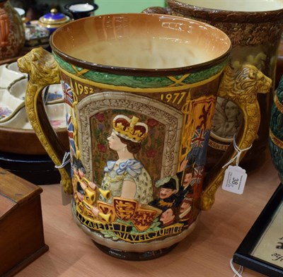 Lot 38 - A Royal Doulton Queen Elizabeth II loving cup 76/250, with certificate of authenticity (2)