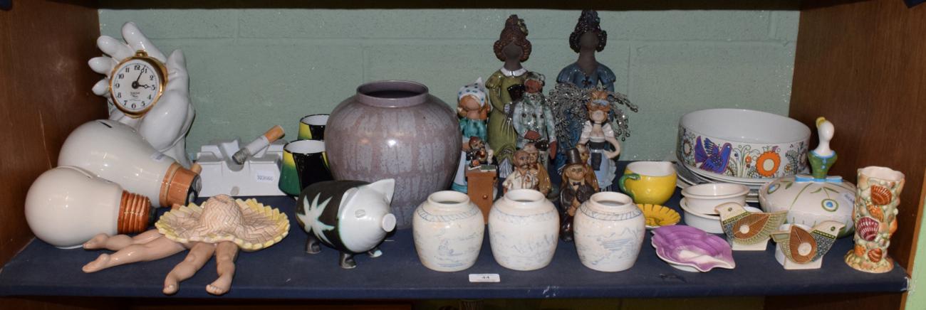 Lot 44 - A collection of novelty ceramics to include various stoneware figures, mugs, novelty ashtray,...