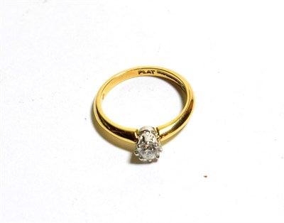 Lot 114 - An 18 carat gold diamond solitaire ring, a round brilliant cut diamond in a claw setting, to...