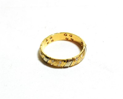 Lot 122 - An 18 carat two colour gold diamond set textured band ring, finger size L1/2