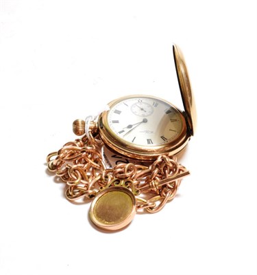 Lot 124 - A gold plated full hunter pocket watch, signed Waltham and a 9 carat gold chain with attached 9...