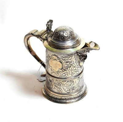 Lot 140 - A silver ewer, the base and handle with cancelled Newcastle marks, the base further stamped...