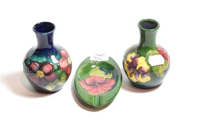 Lot 144 - Moorcroft pottery, two small baluster vases and an ashtray
