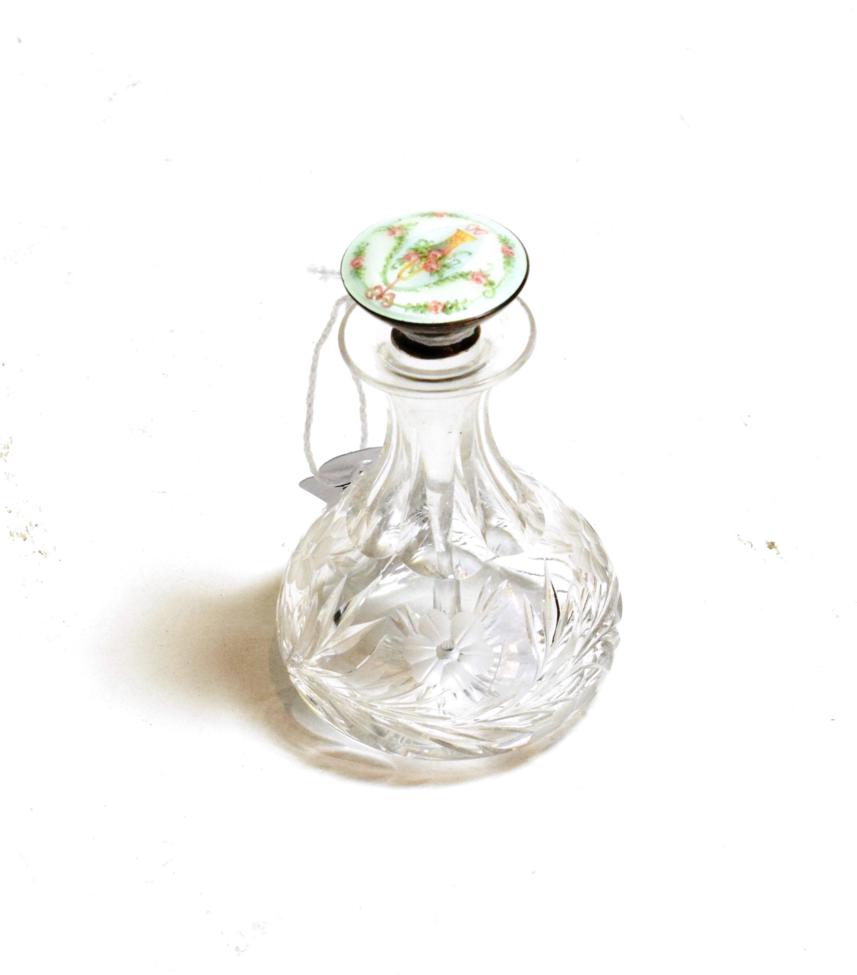 Lot 148 - A cut glass pear shaped scent flask, with enamelled sterling silver stopper