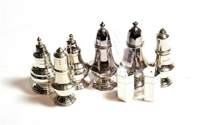Lot 149 - Four pairs of Elizabeth II silver salt and pepper-shakers, one pair by Carrs, Sheffield, 2001,...