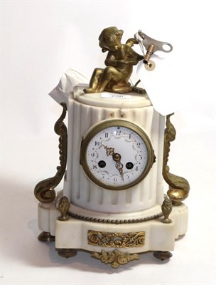 Lot 226 - A 19th century French white marble and gilt metal mantel clock of column form surmounted by a...
