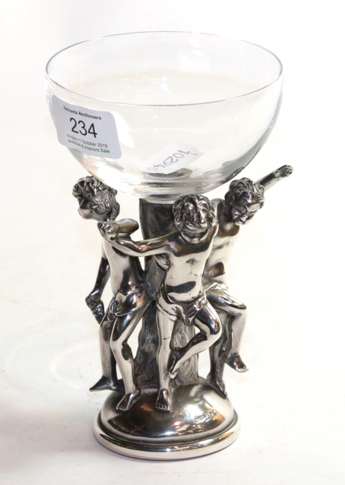 Lot 234 - An Italian white metal and glass Bacchic wine glass by Ottaviani, the bowl supported on figural...