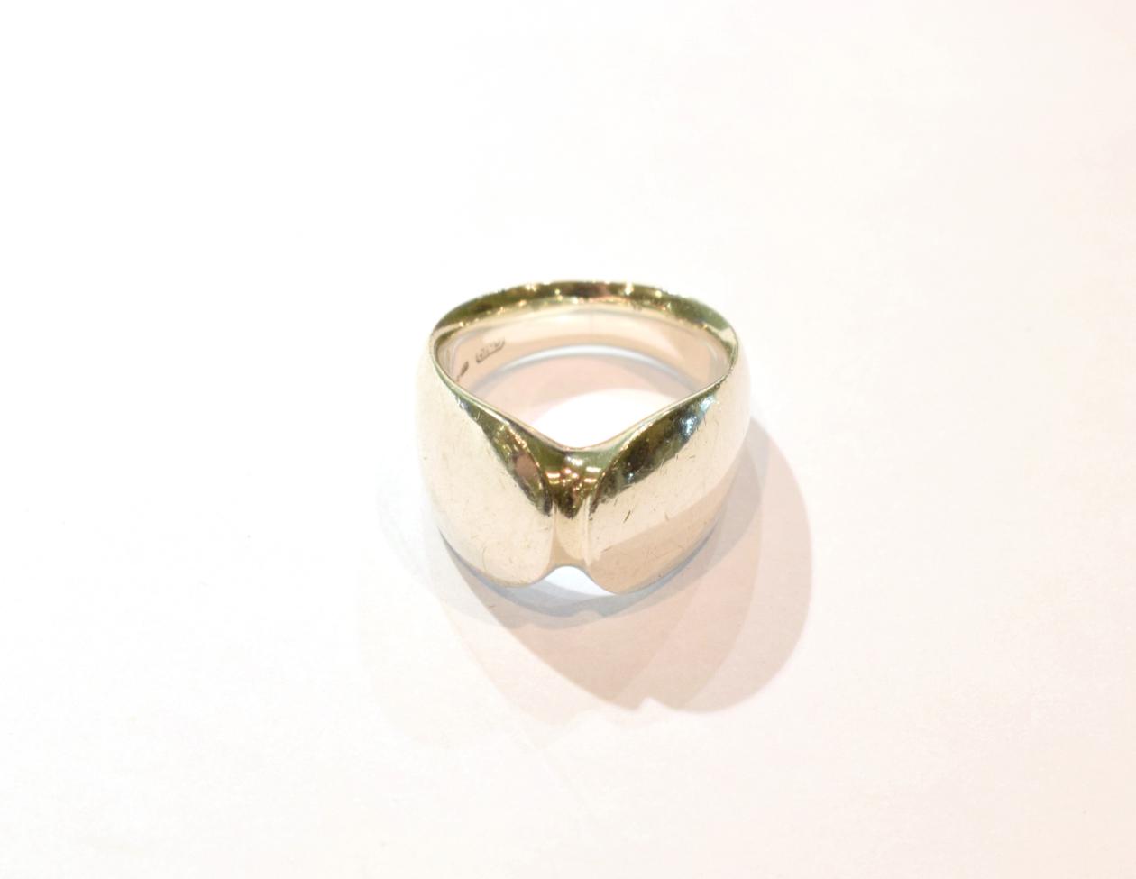 Lot 263 - A contemporary silver ring by George Jensen, of plain polished form, numbered 100, finger size L1/2