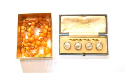 Lot 265 - A set of four mother of pearl buttons, stamped '9CT', cased; five dress studs, stamped '15CT';...